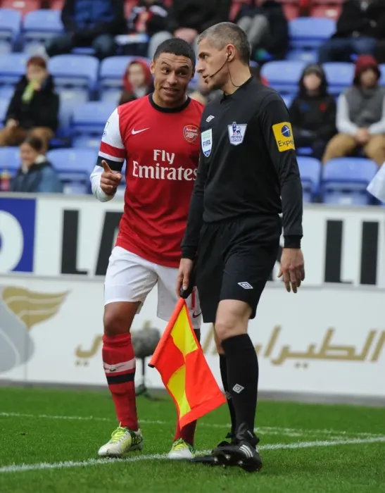 Framed Print : Alex Oxlade-Chamberlain's Playful Moment: Wigan Athletic vs. Arsenal, Premier League 2012-13