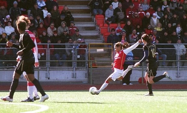 Alex Scott scores Arsenals goal under pressure from Lise Klaveness (Umea)