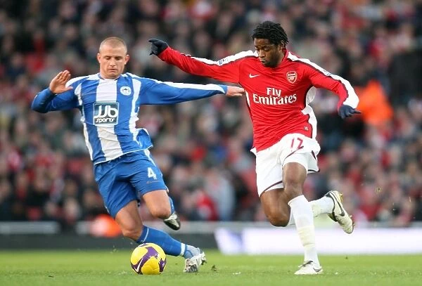 Alex Song (Arsenal) Lee Catermole (Wigan)