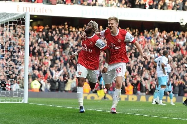 Alex Song celebrates scoring the Arsenal goal with Nicklas Bendtner. Arsenal 1