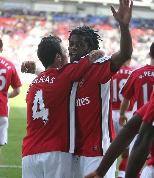 Alex Song and Cesc Fabregas: Celebrating Arsenal's 4th Goal in 1:4 Victory over Wigan Athletic