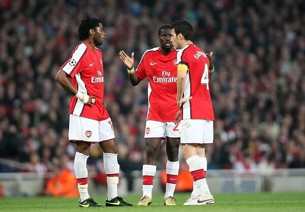 Alex Song, Emmanuel Eboue and Cesc Fabregas (Arsenal)