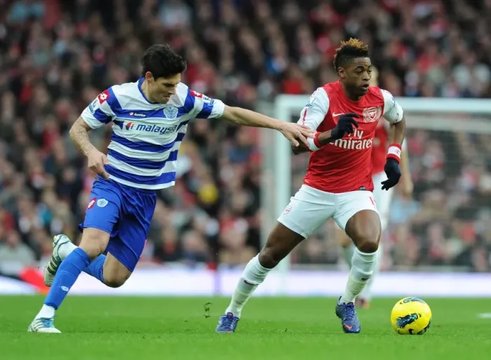 Framed Print : Alex Song Outmaneuvers Alejandro Faurlin in Arsenal's Victory over Queens Park Rangers
