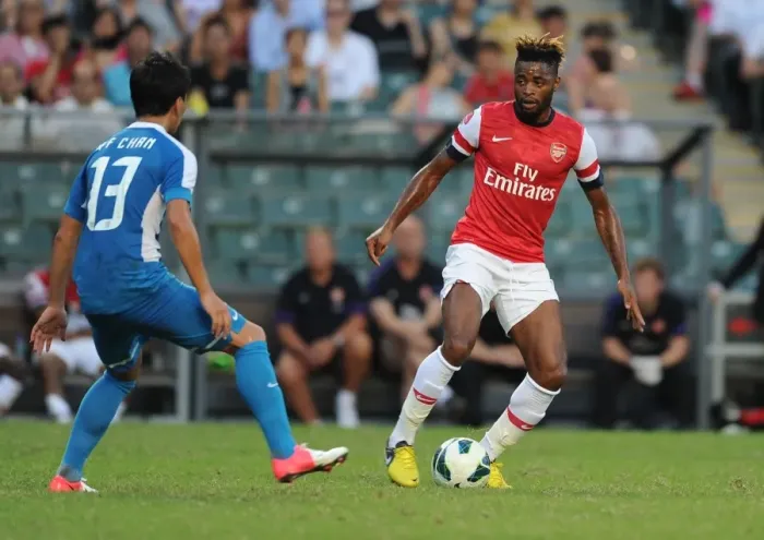 Framed Print : Alex Song vs. Chan Man Fai: Clash of the Midfielders - Kitchee FC vs. Arsenal FC (2012) Framed Print : Alex Song vs. Chan Man Fai: Clash of the Midfielders - Kitchee FC vs. Arsenal FC (2012)