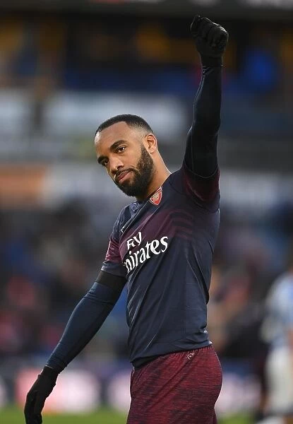 Alexis Lacazette Celebrates with Arsenal Fans after Huddersfield Victory