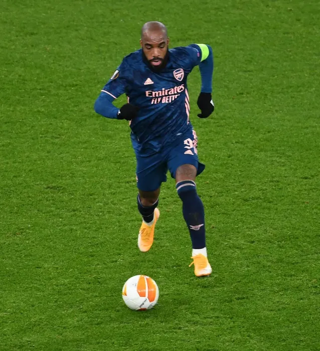Framed Print : Alexis Lacazette Plays Alone: Arsenal's Emirates Emptied for Europa League Clash Against Rapid Wien