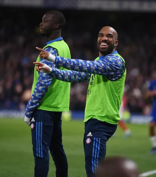 Framed Print : Alexis Lacazette's Light-Hearted Moment: Amidst the Intensity of Chelsea vs. Arsenal, Premier League 2021-22