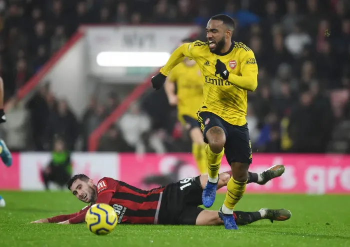 Framed Print : Alexis Lacazette's Slick Moves: Outsmarting Lewis Cook in Arsenal's Premier League Victory (December 2019) Framed Print : Alexis Lacazette's Slick Moves: Outsmarting Lewis Cook in Arsenal's Premier League Victory (December 2019)