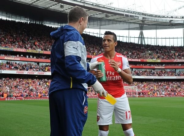 Alexis Sanchez (Arsenal) with Arsenal Physio Colin Lewin before the match. Arsenal 2
