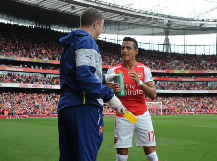 Framed Print : Alexis Sanchez (Arsenal) with Arsenal Physio Colin Lewin before the match. Arsenal 2