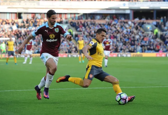 Framed Print : Alexis Sanchez (Arsenal) George Boyd (Burnley). Burnley 0: 1 Arsenal. Premier League Framed Print : Alexis Sanchez (Arsenal) George Boyd (Burnley). Burnley 0: 1 Arsenal. Premier League