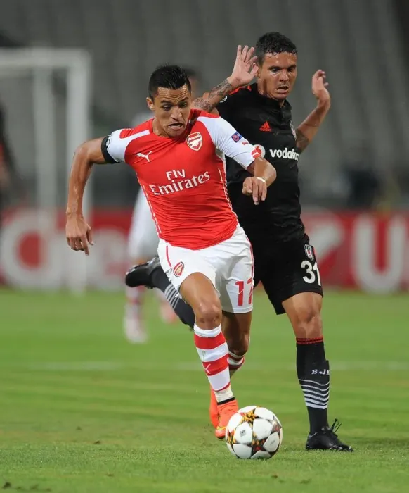 Framed Print : Alexis Sanchez (Arsenal) Ramon Motta (Besiktas). Besiktas 0: 0 Arsenal. UEFA Champions Framed Print : Alexis Sanchez (Arsenal) Ramon Motta (Besiktas). Besiktas 0: 0 Arsenal. UEFA Champions