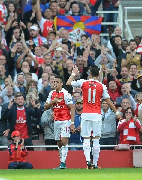 Alexis Sanchez celebrates scoring his 2nd goal, Arsenals 3rd, with his Mesut Ozil