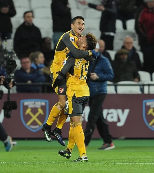 Alexis Sanchez celebrates scoring his 3rd goal, Arsenals 5th, with Alex Oxlade-Chamberlain