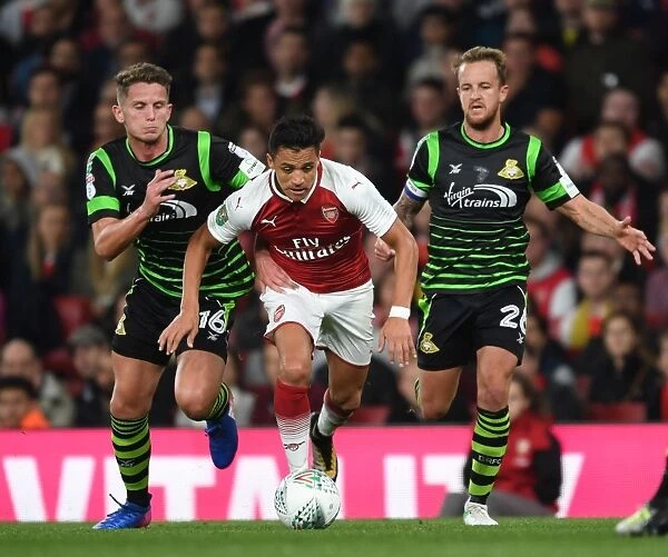 Alexis Sanchez Clashes with Jordan Coppinger in Arsenal's Carabao Cup Battle against Doncaster Rovers