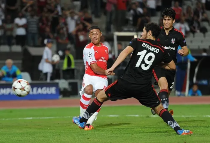 Framed Print : Alexis Sanchez Faces Off Against Pedro Franco: Tense Moment in Arsenal's UEFA Champions League Clash with Besiktas