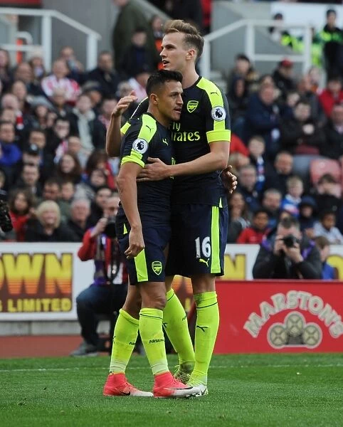 Alexis Sanchez and Rob Holding Celebrate Arsenal's Third Goal vs Stoke City (2016-17)