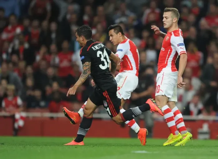Framed Print : Alexis Sanchez Scores Dramatic Goal Against Ramon Motta in Arsenal's UEFA Champions League Showdown with Besiktas Framed Print : Alexis Sanchez Scores Dramatic Goal Against Ramon Motta in Arsenal's UEFA Champions League Showdown with Besiktas