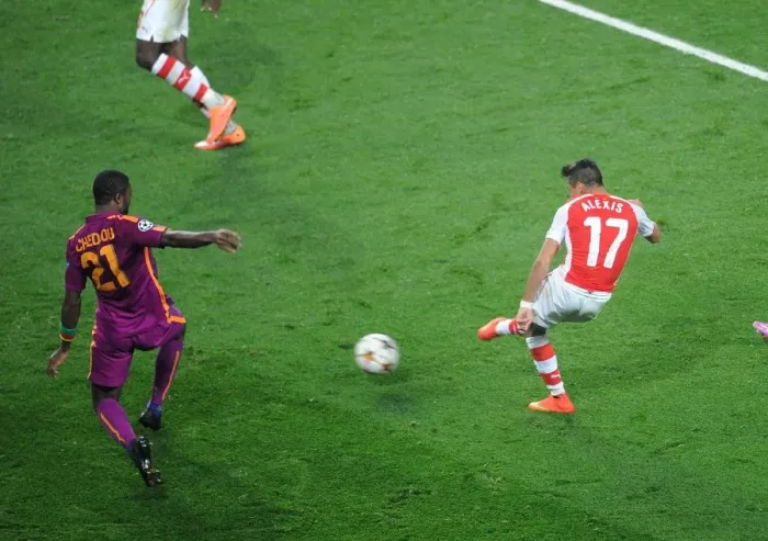 Framed Print : Alexis Sanchez Scores Third Goal Against Aurelien Chedjou in Arsenal's UEFA Champions League Victory Framed Print : Alexis Sanchez Scores Third Goal Against Aurelien Chedjou in Arsenal's UEFA Champions League Victory