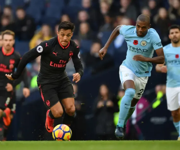 Framed Print : Alexis Sanchez vs. Fernandinho: A Premier League Battle at the Etihad