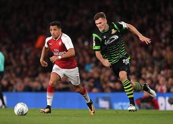 Alexis Sanchez vs. Joe Wright: Arsenal's Star Forward Clashes with Doncaster's Defender in Carabao Cup Showdown