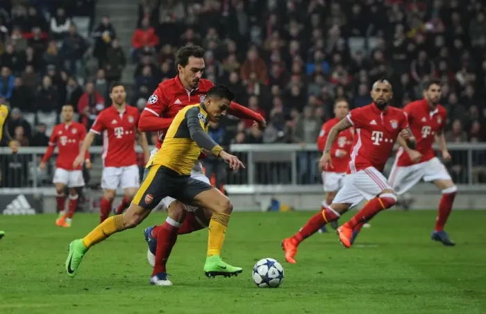 Framed Print : Alexis Sanchez vs. Mats Hummels: Battle in the UEFA Champions League - Arsenal vs. Bayern Munich (2016-17)