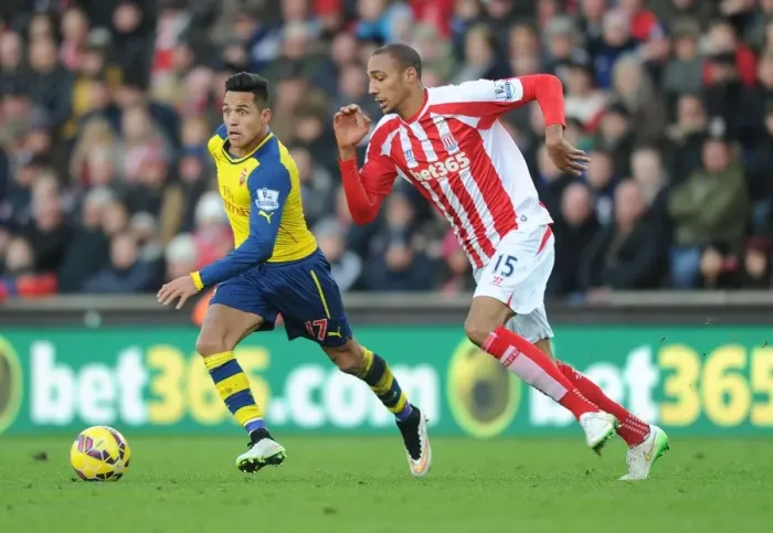 Framed Print : Alexis Sanchez vs. Steven Nzonzi: Intense Battle at the Britannia Stadium (Stoke City v Arsenal, Premier League, 2014)