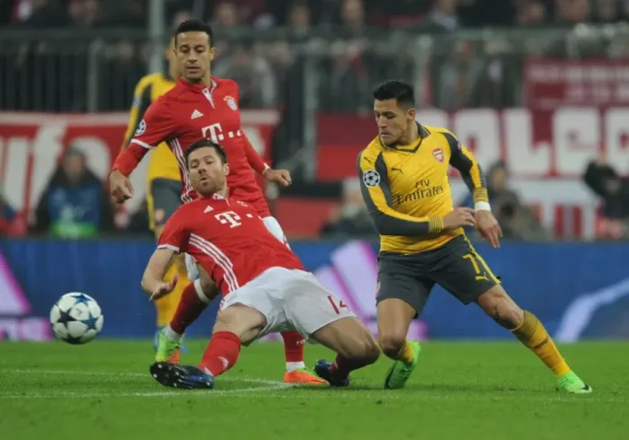 Framed Print : Alexis Sanchez vs Xabi Alonso: Battle in Munich - Arsenal vs Bayern Munich, UEFA Champions League 2016-17 Framed Print : Alexis Sanchez vs Xabi Alonso: Battle in Munich - Arsenal vs Bayern Munich, UEFA Champions League 2016-17