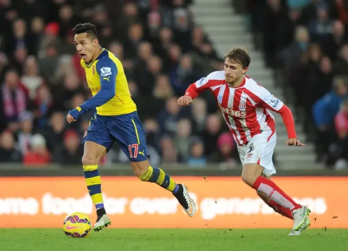Framed Print : Alexis Sanchez's Mesmerizing Skill: Outmaneuvering Marc Muniesa in the Stoke City vs. Arsenal Clash (2014-15) Framed Print : Alexis Sanchez's Mesmerizing Skill: Outmaneuvering Marc Muniesa in the Stoke City vs. Arsenal Clash (2014-15)