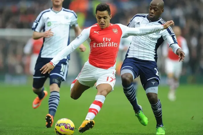 Framed Print : Alexis Sanchez's Slick Moves: Arsenal's Victory Over West Bromwich Albion - Sanchez Outmaneuvers Mulumbu Framed Print : Alexis Sanchez's Slick Moves: Arsenal's Victory Over West Bromwich Albion - Sanchez Outmaneuvers Mulumbu