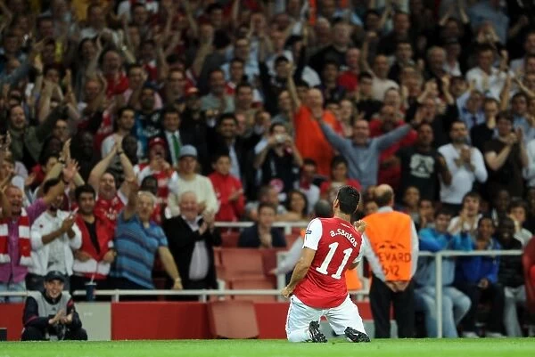 Andre Santos celebrates scoring Arsenals 2nd goal. Arsenal 2: 1 Olympiacos