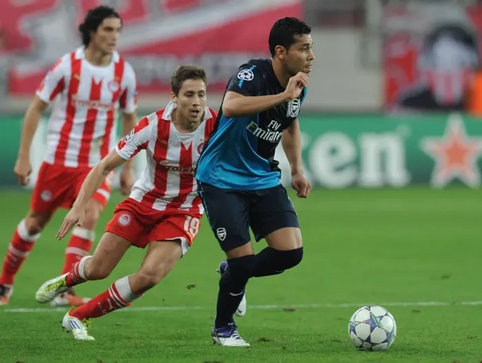 Framed Print : Andre Santos vs. David Fuster: A Battle in the UEFA Champions League between Olympiacos and Arsenal Framed Print : Andre Santos vs. David Fuster: A Battle in the UEFA Champions League between Olympiacos and Arsenal