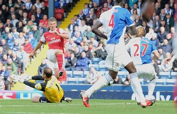 Andrey Arshavin shoots past Blackburn goalkeeper Paul Robinson to score the 2nd Arsenal goal