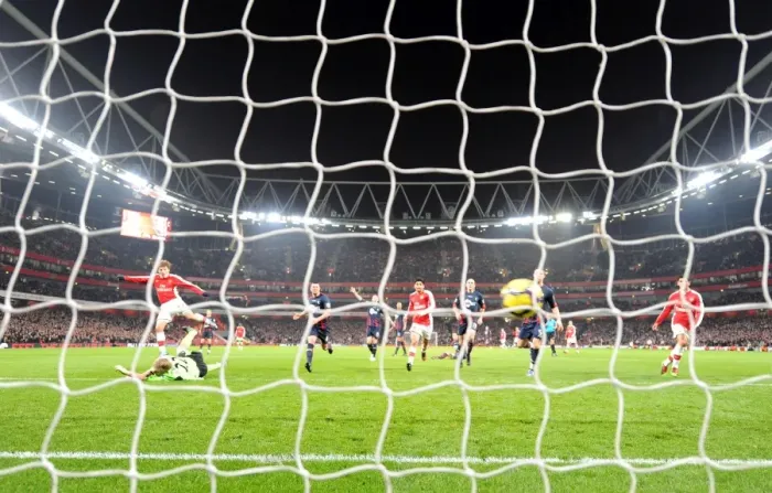 Framed Print : Andrey Arshavin shoots past Bolton goalkeeper Jussi Jskelainen to score the 4th Arsenal goal