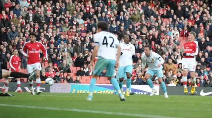 Framed Print : Andrey Arshavin shoots past Burnley goalkeeper Brian Jensen to score the srd Arsenal goal
