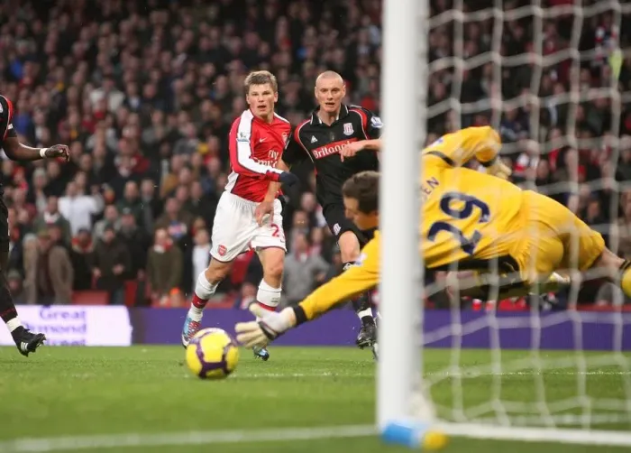 Framed Print : Andrey Arshavin shoots past Stoke City goalkeeper Thomas Sorensen to score the 1st Arsenal goal Framed Print : Andrey Arshavin shoots past Stoke City goalkeeper Thomas Sorensen to score the 1st Arsenal goal