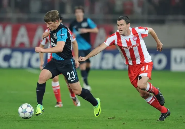 Framed Print : Andrey Arshavin vs. Pablo Orbaiz: Battle in the UEFA Champions League between Olympiacos and Arsenal