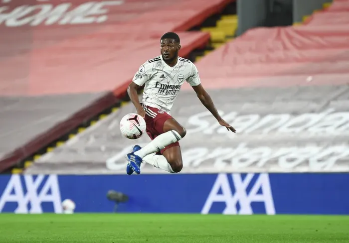 Framed Print : Empty Anfield: Ainsley Maitland-Niles in Action for Arsenal vs Liverpool, 2020-21 Premier League Framed Print : Empty Anfield: Ainsley Maitland-Niles in Action for Arsenal vs Liverpool, 2020-21 Premier League