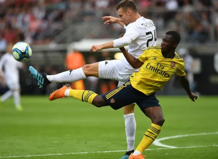 Framed Print : Angers vs. Arsenal: Eddie Nketiah Clashes with Romain Thomas in Pre-Season Friendly Framed Print : Angers vs. Arsenal: Eddie Nketiah Clashes with Romain Thomas in Pre-Season Friendly
