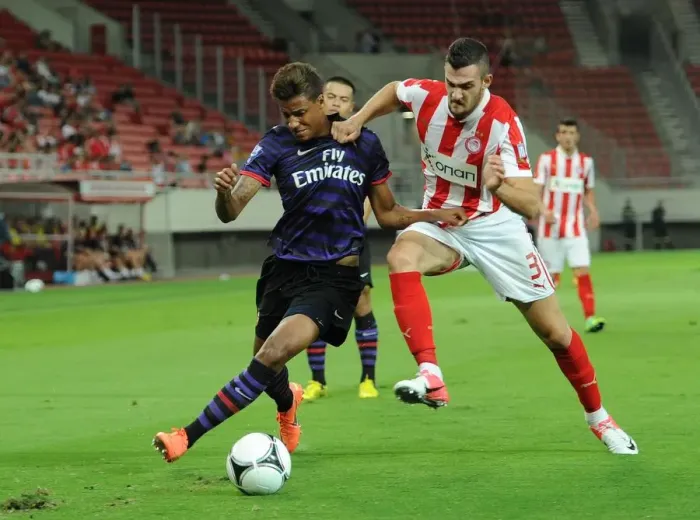 Framed Print : Angha vs. Lykogiannis: Tense Moment in Olympiacos vs. Arsenal NextGen Series Match