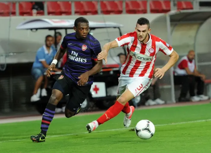 Framed Print : Anthony Jeffrey vs. Charalampos Lykogiannis: Tense Moment in Olympiacos vs. Arsenal NextGen Series Match