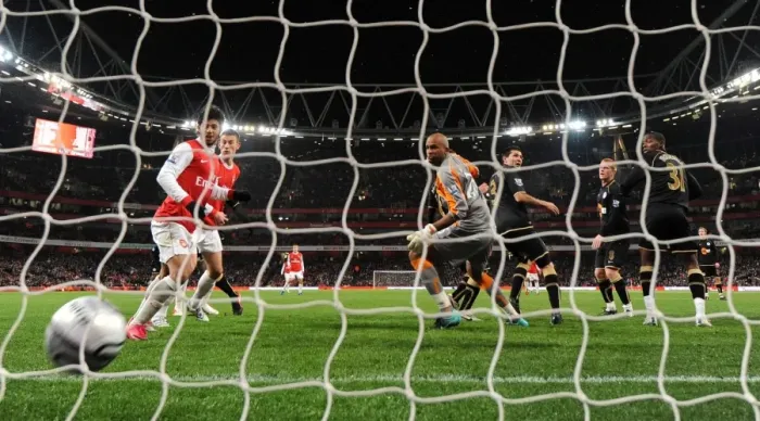 Framed Print : Antolin Alcaraz (Wigan No. 3) scores an own goal for Arsenals 1st goal