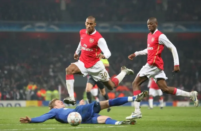 Framed Print : Armand Traore and Abu Diaby (Arsenal) Dorin Goian (Bucuresti)