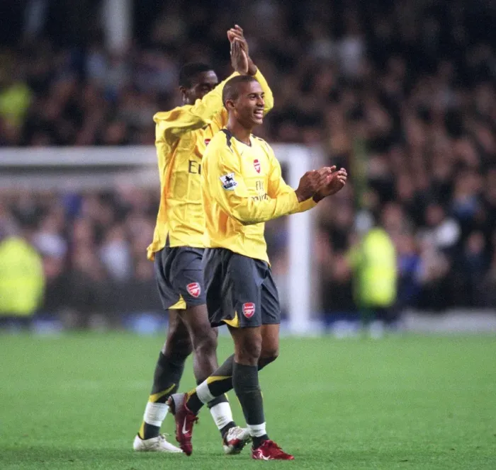 Framed Print : Armand Traore and Johan Djourou (Arsenal) clap the fans after the match