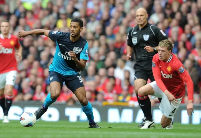Framed Print : Armand Traore vs. Phil Jones: A Premier League Battle at Old Trafford (2011-12)