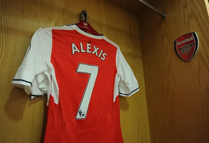 Framed Print : Arsenal: Alexis Sanchez's Emirates Jersey Hanging in the Changing Room Before Arsenal vs. Everton (2016-17) Framed Print : Arsenal: Alexis Sanchez's Emirates Jersey Hanging in the Changing Room Before Arsenal vs. Everton (2016-17)