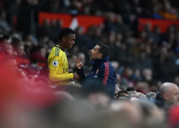 Framed Print : Arsenal Assistant Coach Juan Carlos Cardedo Conferring with Joe Willock during Manchester United vs Arsenal (2019-20)