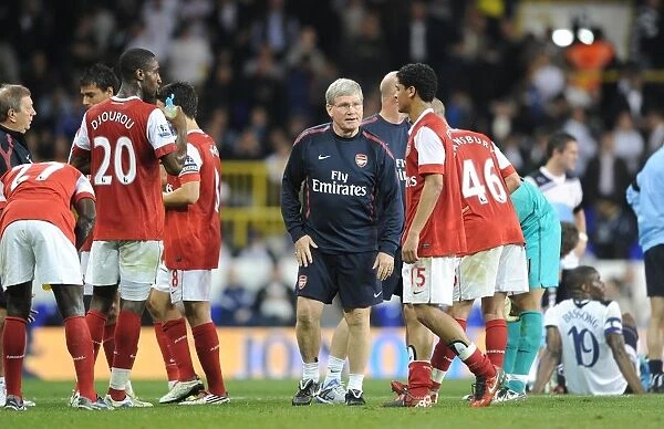 Arsenal assistant manager Pat Rice talks to the players before extra time