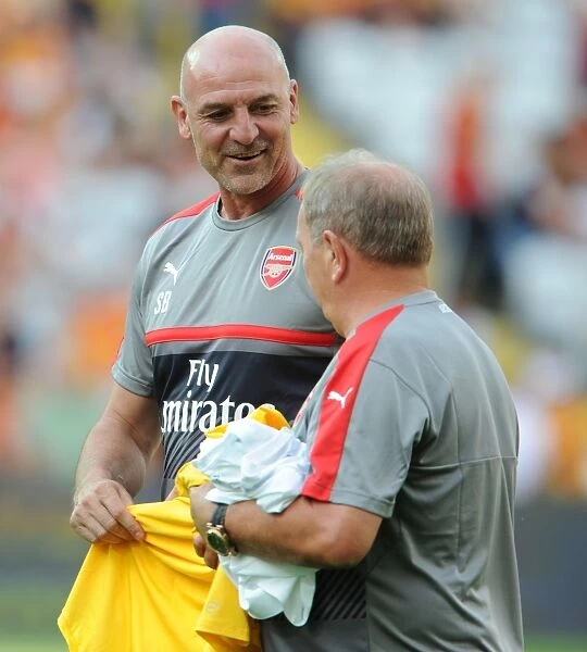 Arsenal Assistants Bring Humor to Pre-Season Training: Steve Bould and Vic Akers Joke Around at RC Lens Friendly
