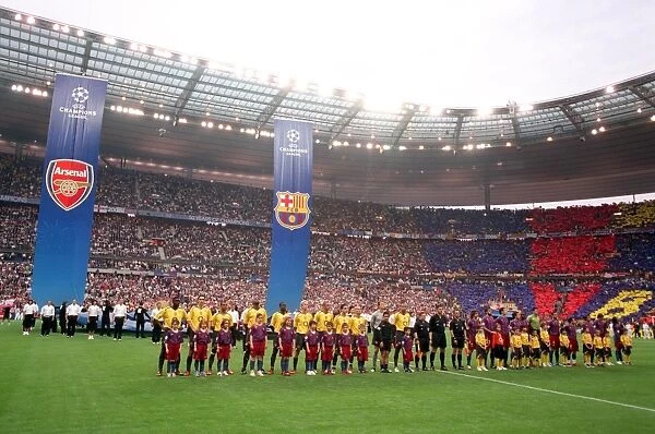 The Arsenal and Barcelona players line up before the match